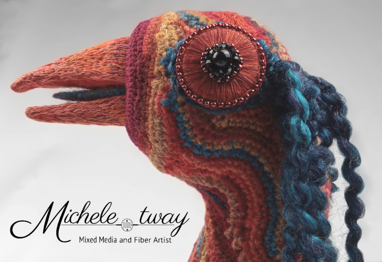 Close up of Alicia's hand embroidered beak and eye; a mixed media sculpture by Michele Tway.