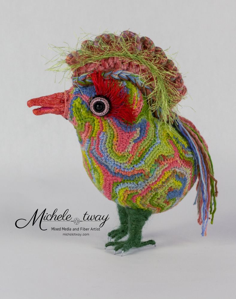 Maya is a mixed media fiber art sculpture featuring a crochet body and an embroidered beak.