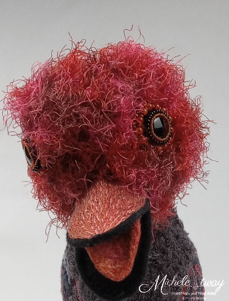 Maya, a citrus-themed, bird sculpture by Michele Tway.