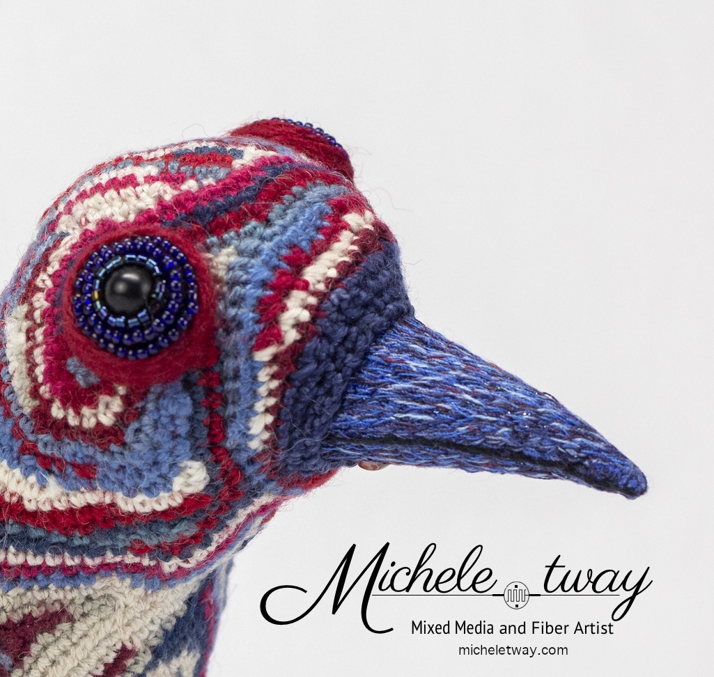 Maya, a citrus-themed, bird sculpture by Michele Tway.