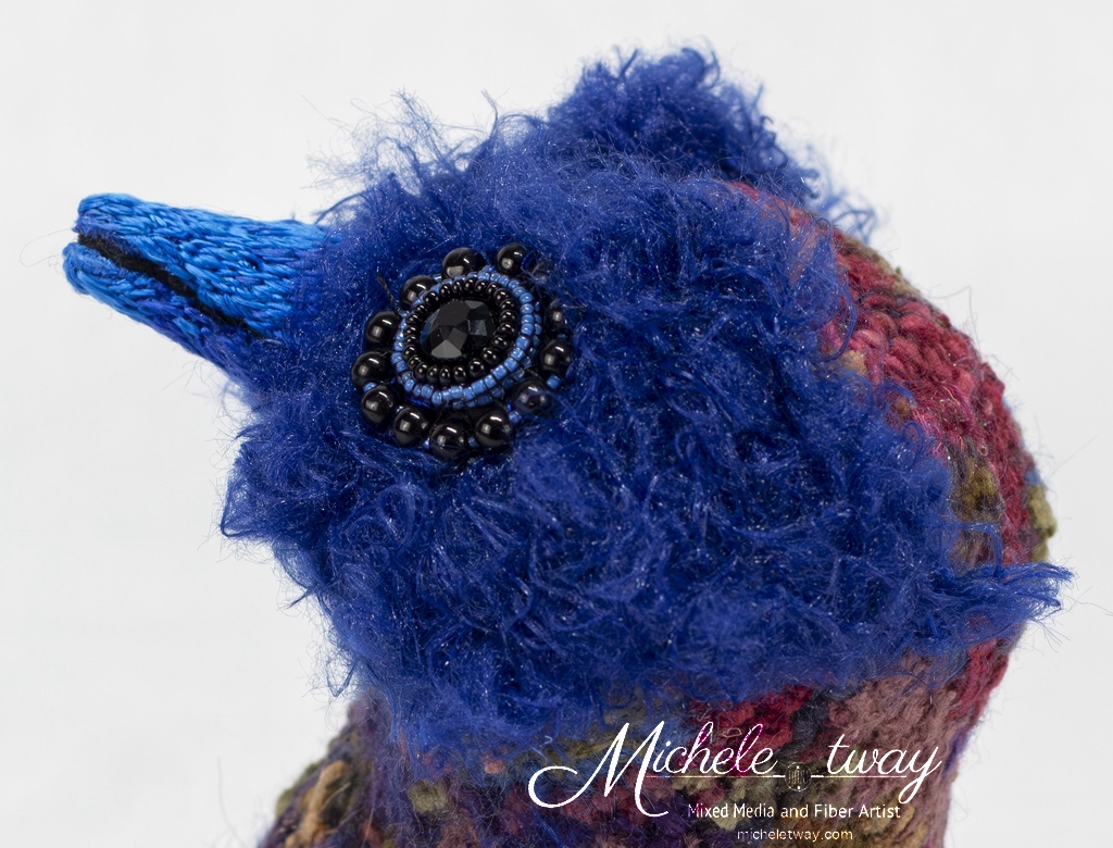 Maya, a citrus-themed, bird sculpture by Michele Tway.