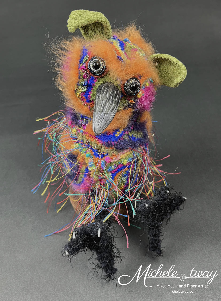 Emmitt, a most brightly colored little birdy elf.