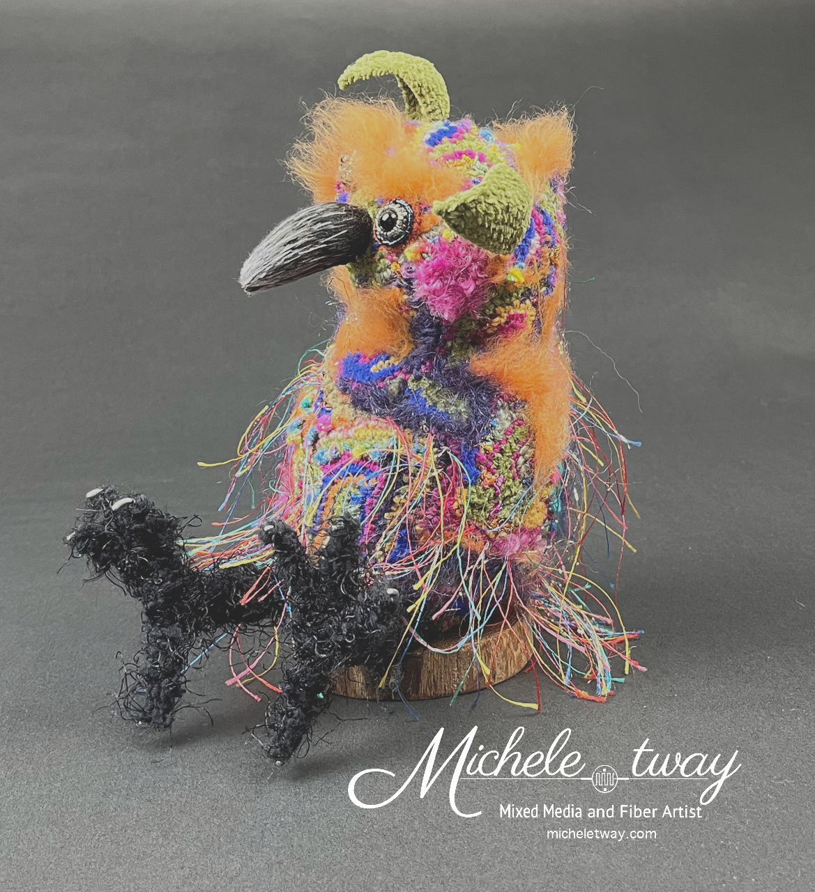Brightly colored mixed media fiber art bird-like elf sculpture by Michele Tway.